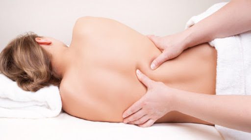 Client lying on her side during a massage